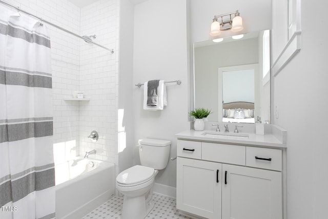 1514 W Knox St, Durham, NC 27705 - bathroom with vanity, shower / bath combo with shower curtain, toilet, tile patterned floors, and baseboards