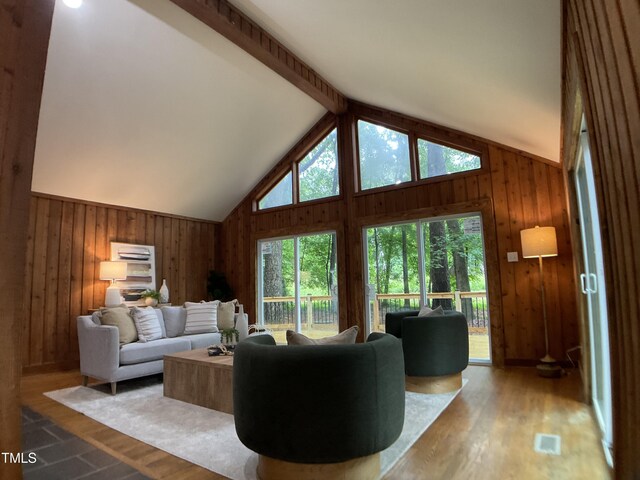 102 Pebble Ct, Chapel Hill, NC 27516 - living area with wooden walls, vaulted ceiling, and wood finished floors