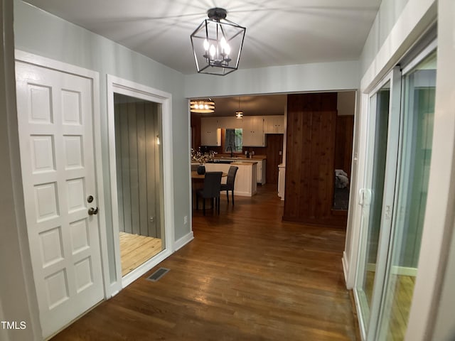 102 Pebble Ct, Chapel Hill, NC 27516 - foyer entrance featuring a chandelier and dark wood finished floors