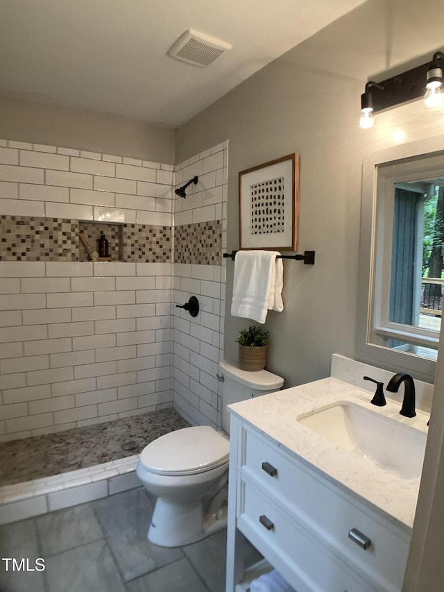 102 Pebble Ct, Chapel Hill, NC 27516 - bathroom with vanity, tiled shower, and toilet