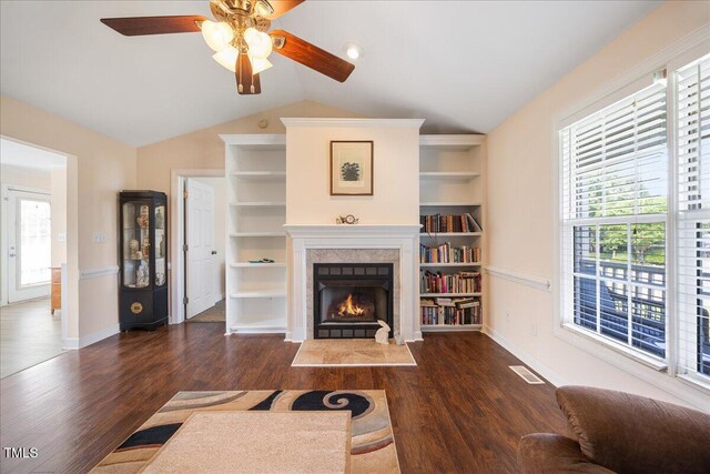 124 Roscommon Ln, Clayton, NC 27520 - living room featuring vaulted ceiling, ceiling fan, wood finished floors, a premium fireplace, and baseboards