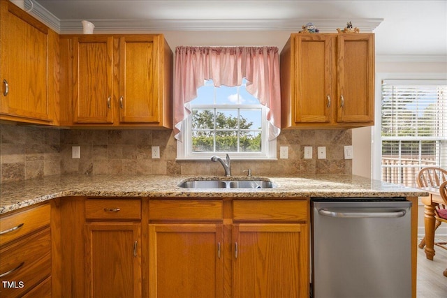124 Roscommon Ln, Clayton, NC 27520 - kitchen featuring dishwasher, a sink, ornamental molding, brown cabinets, and light stone countertops