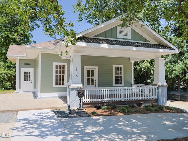 2106 University Dr, Durham, NC 27707 - view of front facade with covered porch and board and batten siding