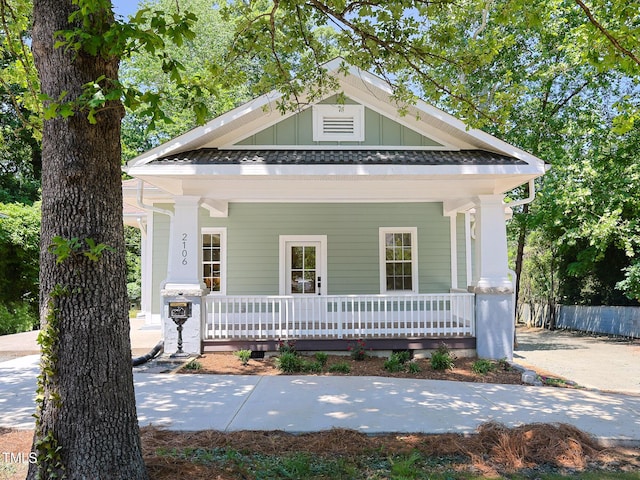 2106 University Dr, Durham, NC 27707 - shotgun-style home featuring a porch and board and batten siding