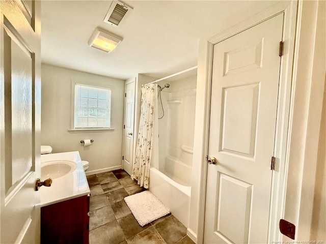 5089 Tobacco Rd, Orrum, NC 28369 - full bath with toilet, vanity, shower / bath combination with curtain, and baseboards