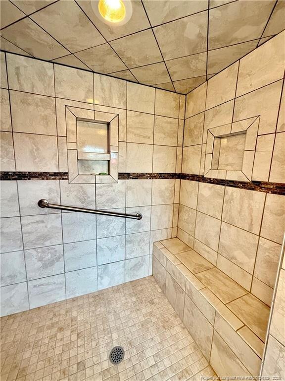 5089 Tobacco Rd, Orrum, NC 28369 - full bath with tiled shower