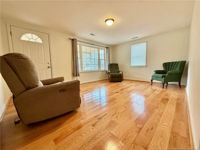 5089 Tobacco Rd, Orrum, NC 28369 - sitting room with light wood-style floors and baseboards