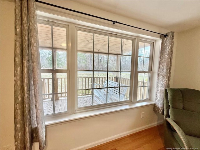 5089 Tobacco Rd, Orrum, NC 28369 - living area with healthy amount of natural light, wood finished floors, and baseboards