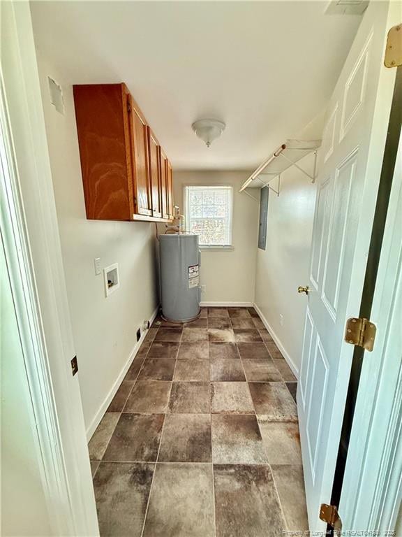5089 Tobacco Rd, Orrum, NC 28369 - laundry area featuring water heater, cabinet space, hookup for a washing machine, baseboards, and dark stone finish floors