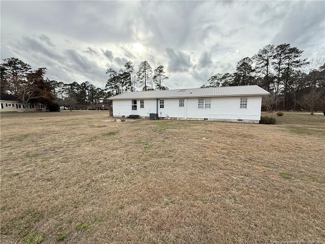 5089 Tobacco Rd, Orrum, NC 28369 - rear view of house with metal roof and a yard