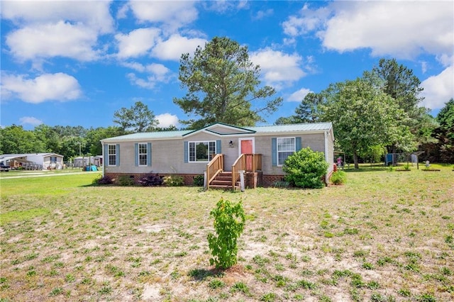 7504 Hidden Ln, Roseboro, NC 28382 - manufactured / mobile home with a front lawn and crawl space