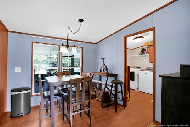 7504 Hidden Ln, Roseboro, NC 28382 - dining room with washer and dryer, crown molding, light wood-style floors, and a chandelier