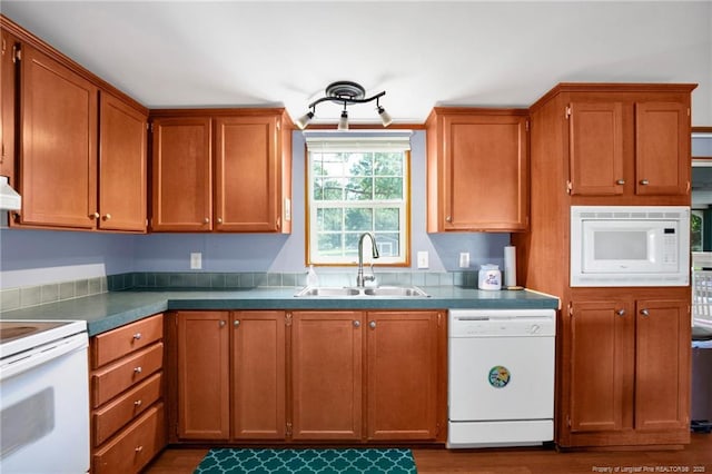 7504 Hidden Ln, Roseboro, NC 28382 - kitchen with white appliances, a sink, brown cabinetry, dark wood-style flooring, and range hood
