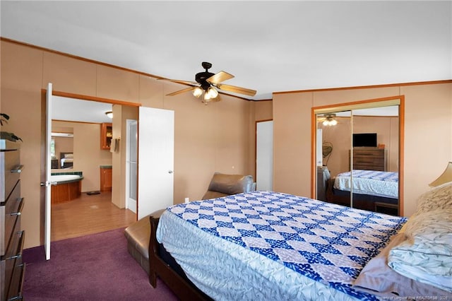 7504 Hidden Ln, Roseboro, NC 28382 - bedroom with dark colored carpet, a ceiling fan, and a closet