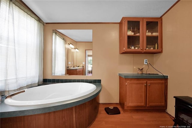 7504 Hidden Ln, Roseboro, NC 28382 - full bath featuring a bath, wood finished floors, and vanity