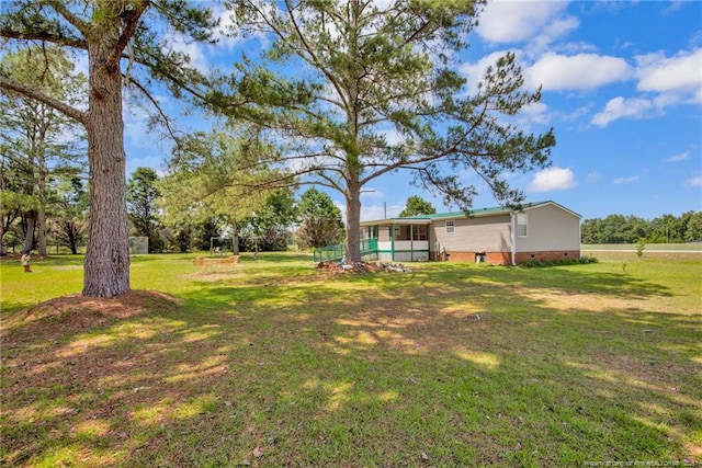7504 Hidden Ln, Roseboro, NC 28382 - view of grassy yard with a sunroom