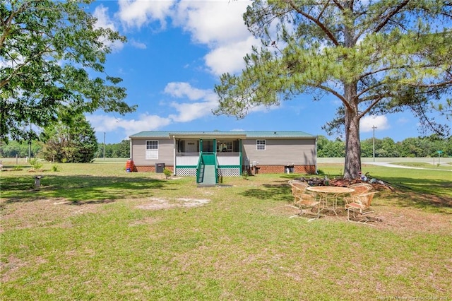 7504 Hidden Ln, Roseboro, NC 28382 - back of house featuring a lawn and a sunroom