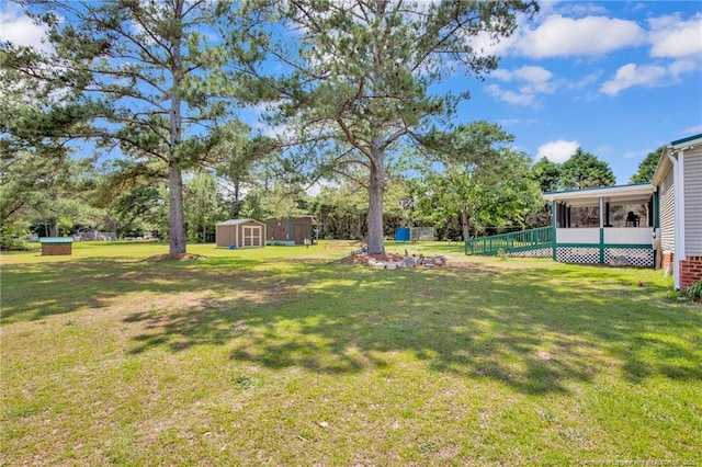 7504 Hidden Ln, Roseboro, NC 28382 - view of green lawn with a sunroom and view of scattered trees