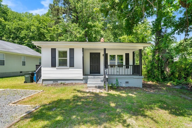104 Archdale Dr, Durham, NC 27707 - view of front facade with crawl space, covered porch, and a front yard