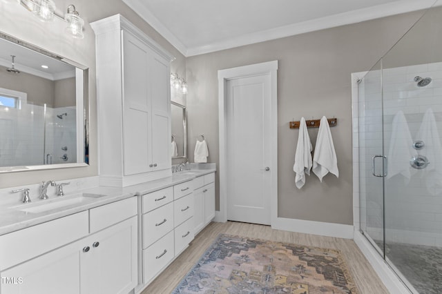 1412 Wakefield Farm Rd, Zebulon, NC 27597 - full bathroom featuring crown molding, a stall shower, double vanity, wood finished floors, and baseboards