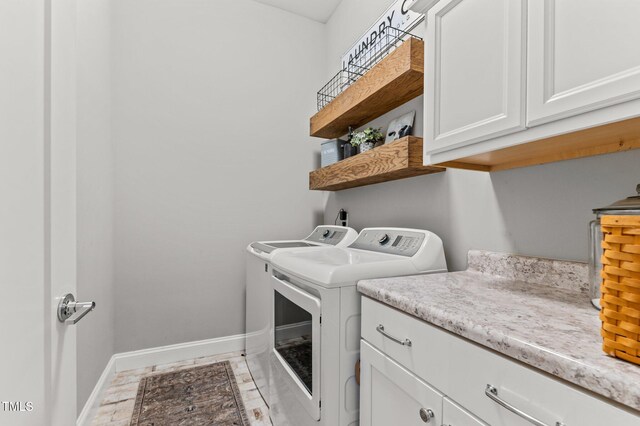 1412 Wakefield Farm Rd, Zebulon, NC 27597 - laundry room featuring washer and dryer, cabinet space, and baseboards