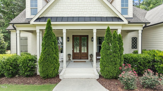 1412 Wakefield Farm Rd, Zebulon, NC 27597 - doorway to property featuring a porch, a standing seam roof, and roof with shingles