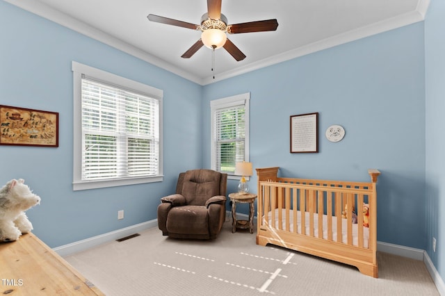 1412 Wakefield Farm Rd, Zebulon, NC 27597 - carpeted bedroom with a nursery area, baseboards, crown molding, and ceiling fan