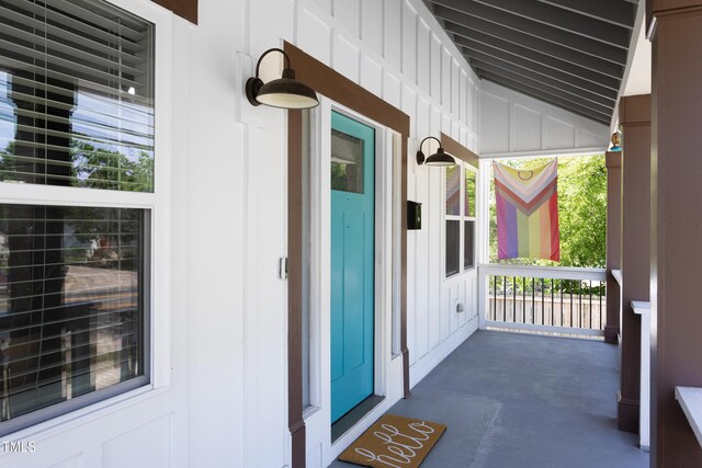 2805 Fayetteville St, Durham, NC 27707 - doorway to property featuring board and batten siding and covered porch