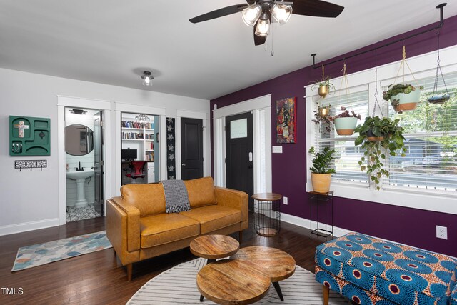 2805 Fayetteville St, Durham, NC 27707 - living room with baseboards, wood finished floors, and ceiling fan
