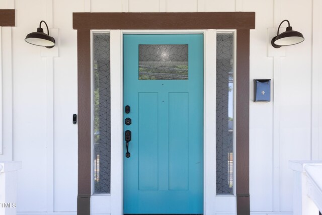 2805 Fayetteville St, Durham, NC 27707 - doorway to property with board and batten siding