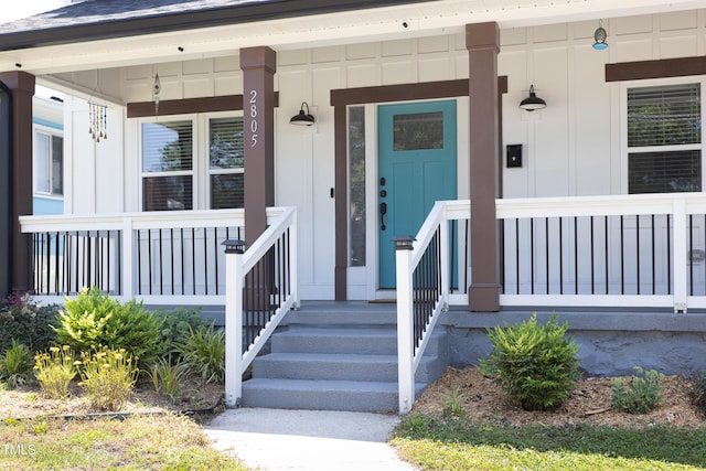 2805 Fayetteville St, Durham, NC 27707 - property entrance featuring a porch and board and batten siding