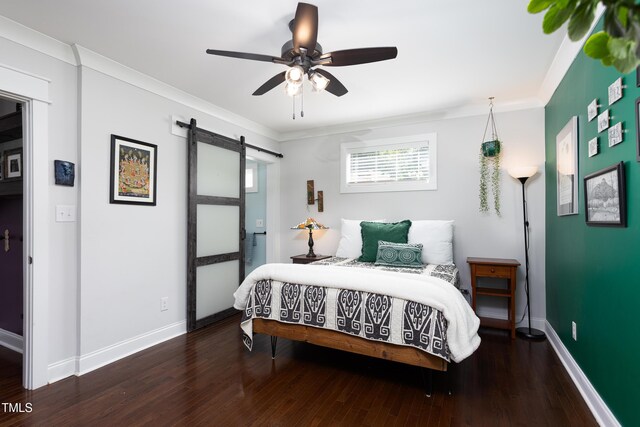 2805 Fayetteville St, Durham, NC 27707 - bedroom with a barn door, wood finished floors, baseboards, ornamental molding, and ceiling fan