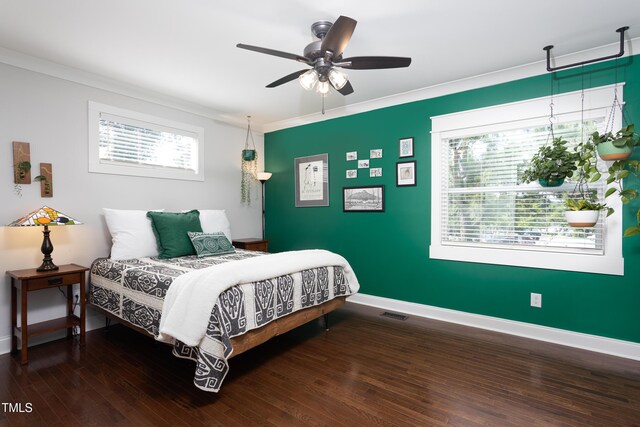 2805 Fayetteville St, Durham, NC 27707 - bedroom featuring baseboards, wood finished floors, ornamental molding, and a ceiling fan