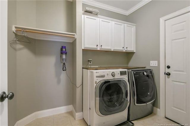 71 Orchard Falls Dr, Spring Lake, NC 28390 - washroom with washing machine and dryer, cabinet space, ornamental molding, baseboards, and light tile patterned flooring