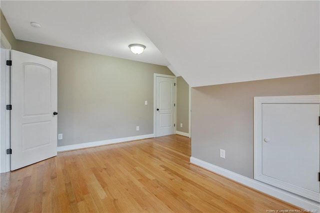 71 Orchard Falls Dr, Spring Lake, NC 28390 - additional living space featuring light wood-style floors, baseboards, and vaulted ceiling