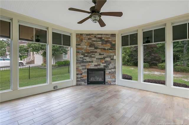 71 Orchard Falls Dr, Spring Lake, NC 28390 - unfurnished sunroom featuring healthy amount of natural light, ceiling fan, and a fireplace