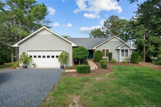 116 Fox Run Ct, West End, NC 27376 - ranch-style house with a garage, driveway, and a front yard