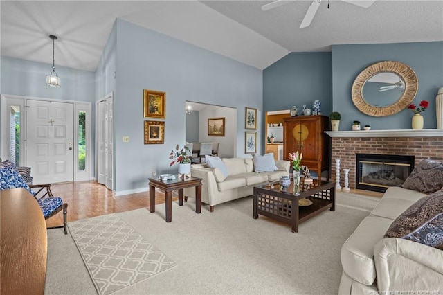 116 Fox Run Ct, West End, NC 27376 - carpeted living room with a ceiling fan, high vaulted ceiling, baseboards, and a fireplace