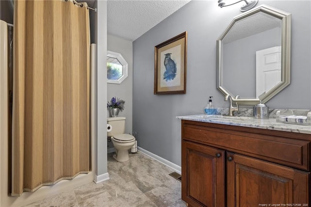 116 Fox Run Ct, West End, NC 27376 - full bath featuring vanity, toilet, a textured ceiling, baseboards, and a shower with shower curtain