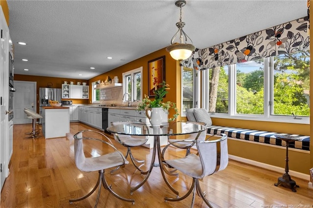 116 Fox Run Ct, West End, NC 27376 - dining room with a textured ceiling, light wood-style floors, recessed lighting, and baseboards