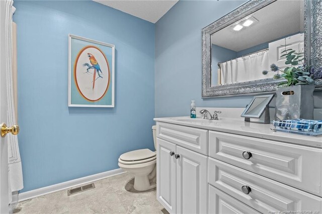 116 Fox Run Ct, West End, NC 27376 - full bath with vanity, toilet, and baseboards