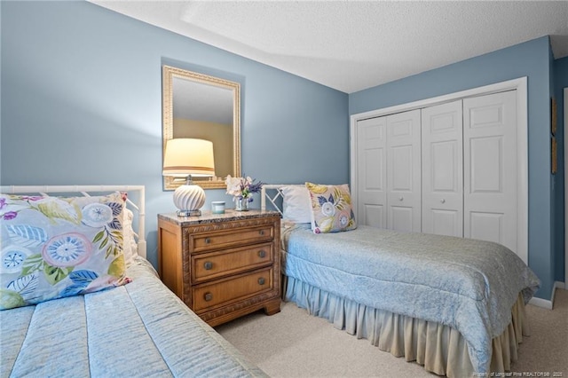 116 Fox Run Ct, West End, NC 27376 - carpeted bedroom with a closet and a textured ceiling