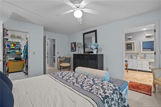 116 Fox Run Ct, West End, NC 27376 - carpeted bedroom with a spacious closet, a closet, ceiling fan, and ensuite bathroom