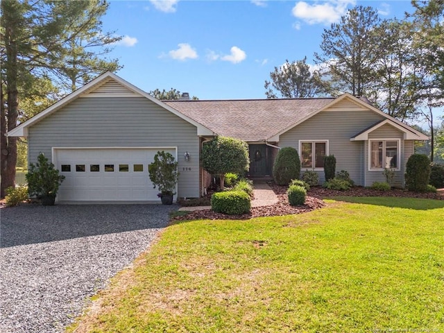 116 Fox Run Ct, West End, NC 27376 - ranch-style house with driveway, a garage, and a front lawn