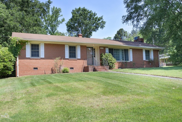 1209 Landon St, Durham, NC 27703 - ranch-style home with crawl space, a chimney, brick siding, and a front lawn