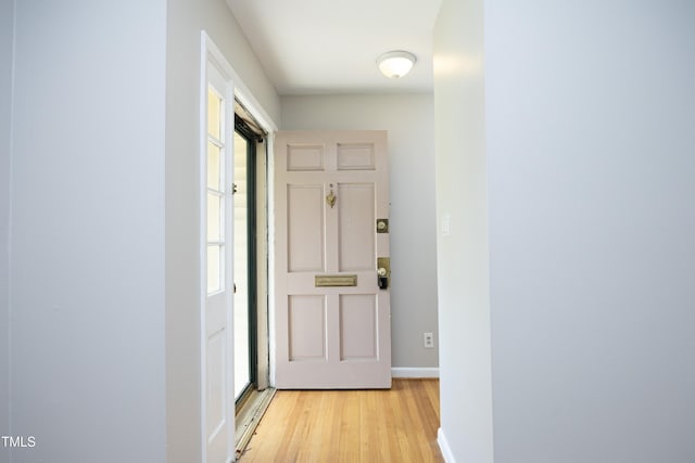 1209 Landon St, Durham, NC 27703 - hallway featuring light wood finished floors, healthy amount of natural light, and baseboards