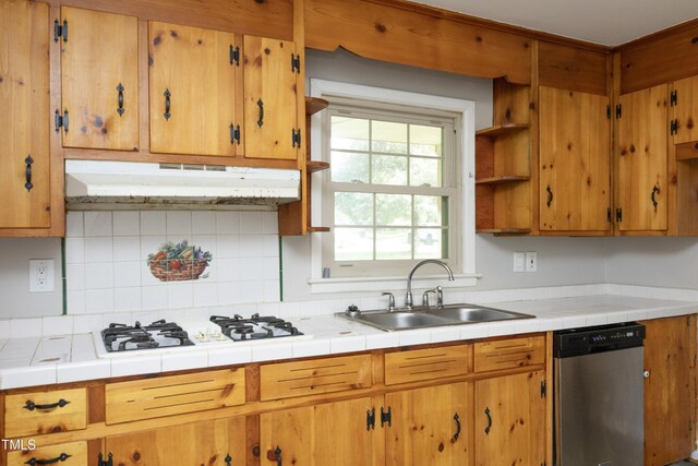 1209 Landon St, Durham, NC 27703 - kitchen featuring stainless steel dishwasher, under cabinet range hood, white gas cooktop, a sink, and tasteful backsplash