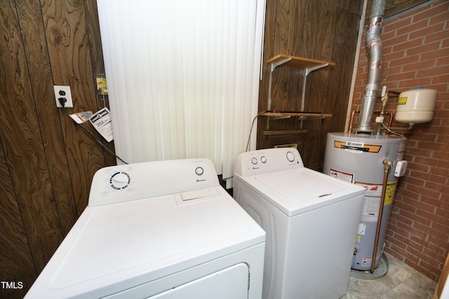 1209 Landon St, Durham, NC 27703 - laundry area with separate washer and dryer, water heater, and brick wall
