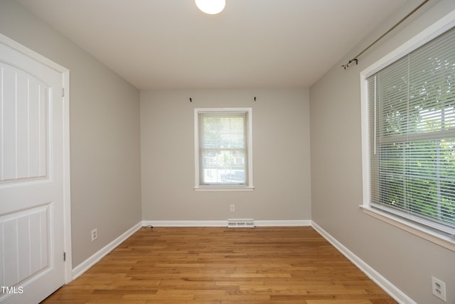 1209 Landon St, Durham, NC 27703 - spare room featuring light wood-type flooring and baseboards