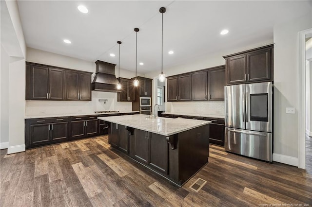 405 Gilpin Way, Cary, NC 27519 - kitchen with appliances with stainless steel finishes, custom exhaust hood, dark wood-type flooring, dark brown cabinetry, and recessed lighting